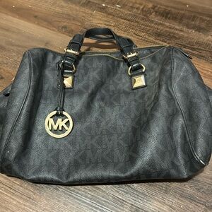Used Mikael Kors black bag